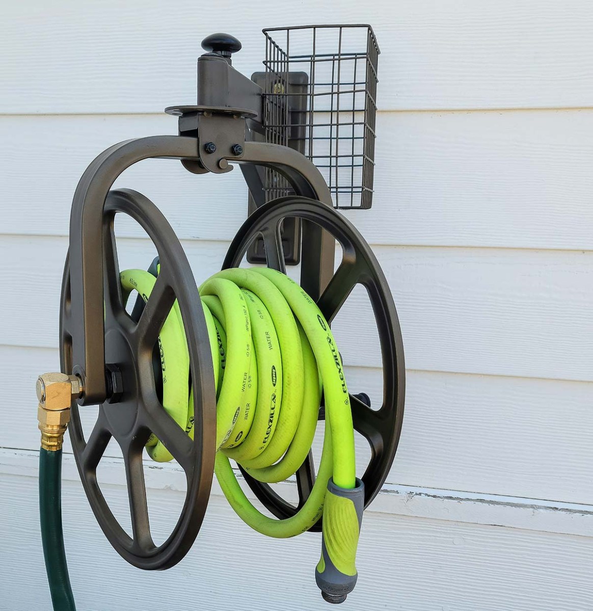 Bright yellow rubber hose wrapped around a mounted hose reel