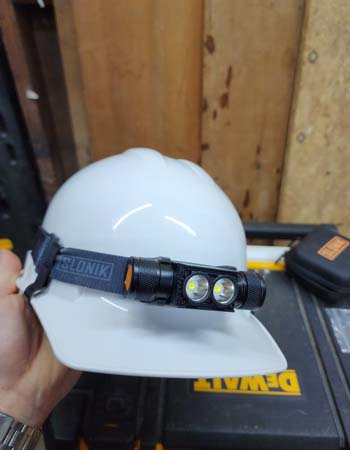 Slonik Hard Hat Light attached to a hard hat