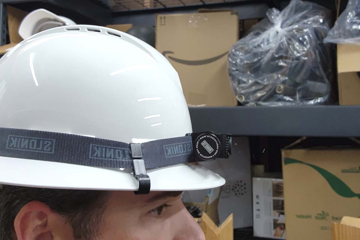 Slonik Hard Hat Light attached to a hard hat that's being worn