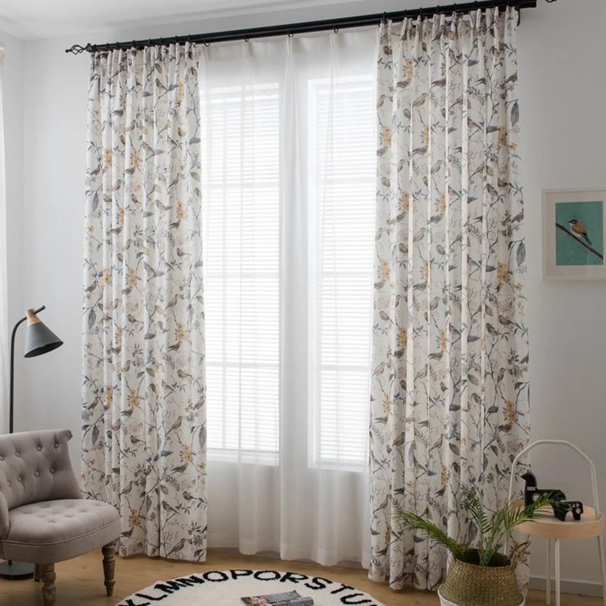 Bright window with curtains layered with print curtains