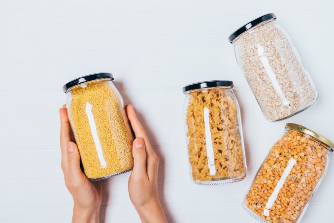 foods that never expire - hands holding jar of dried food