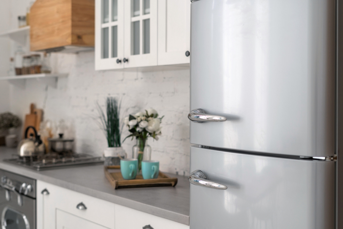 never plug into power strip - modern silver refrigerator in kitchen