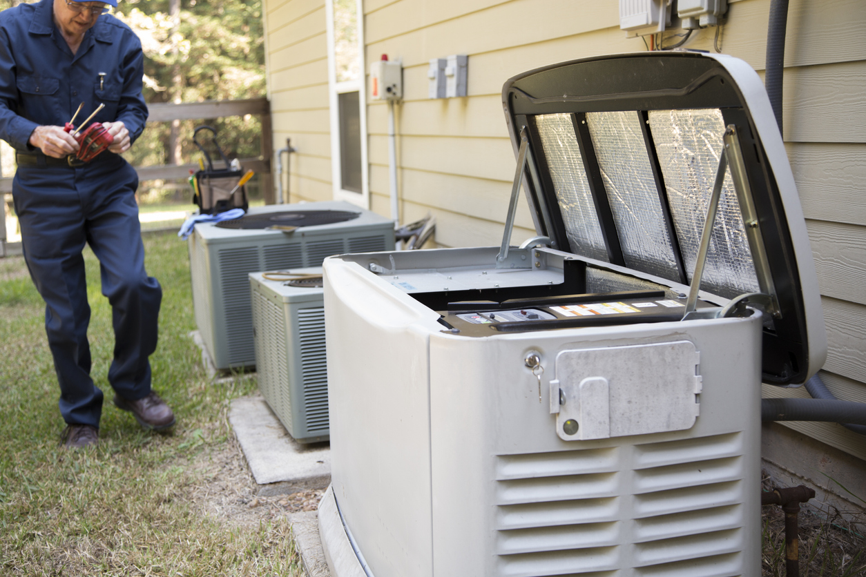 iStock-1278295972 standby generator technician services outside AC units and generator