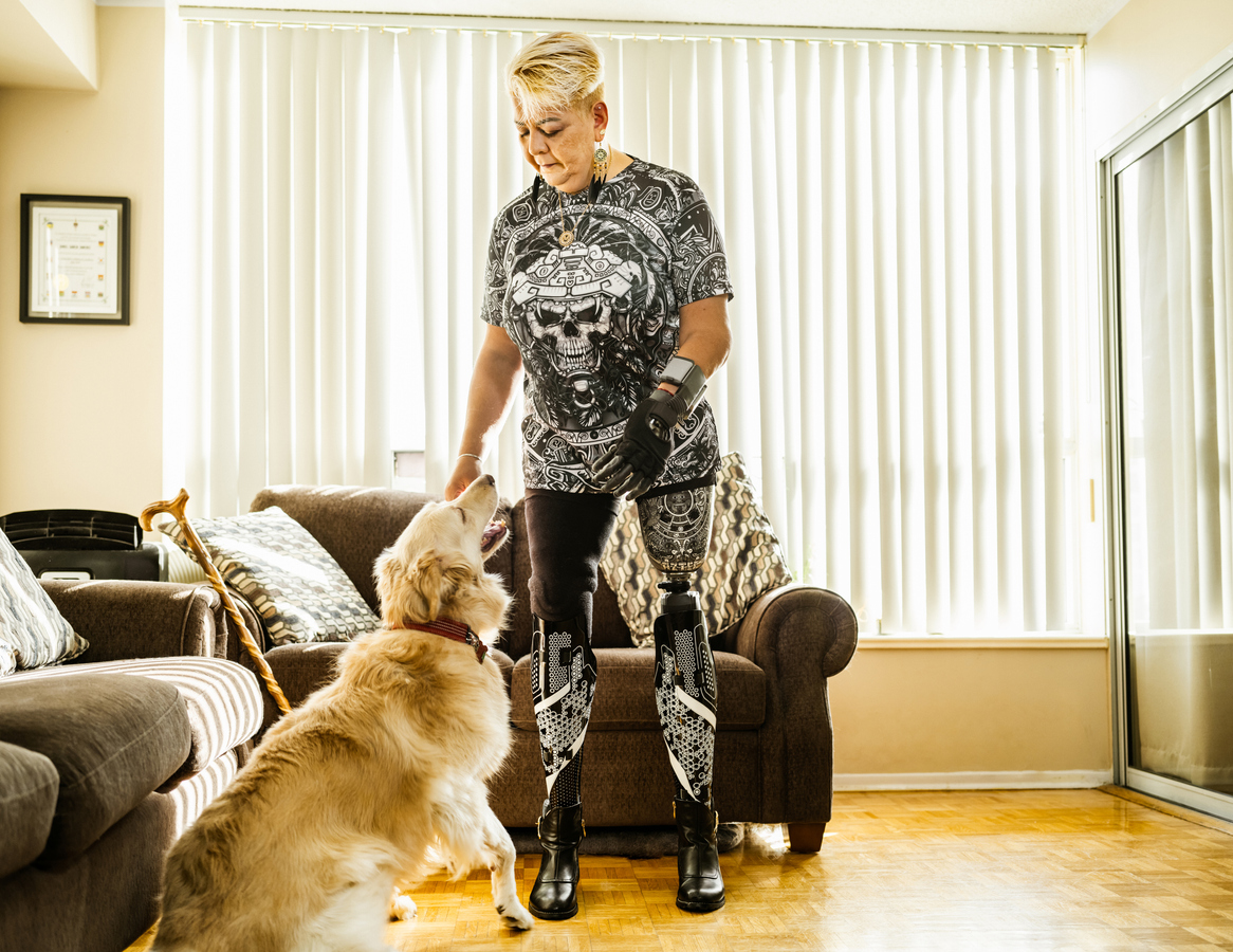 Mature Latin woman with disability and her dog