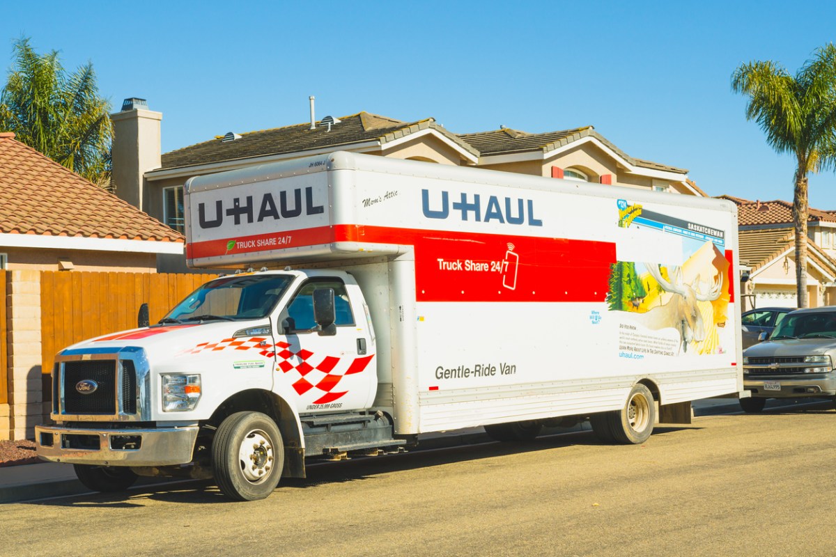 iStock-1469893376 Moving Container vs Truck Rental U-Haul rental truck parked on the street close to the house