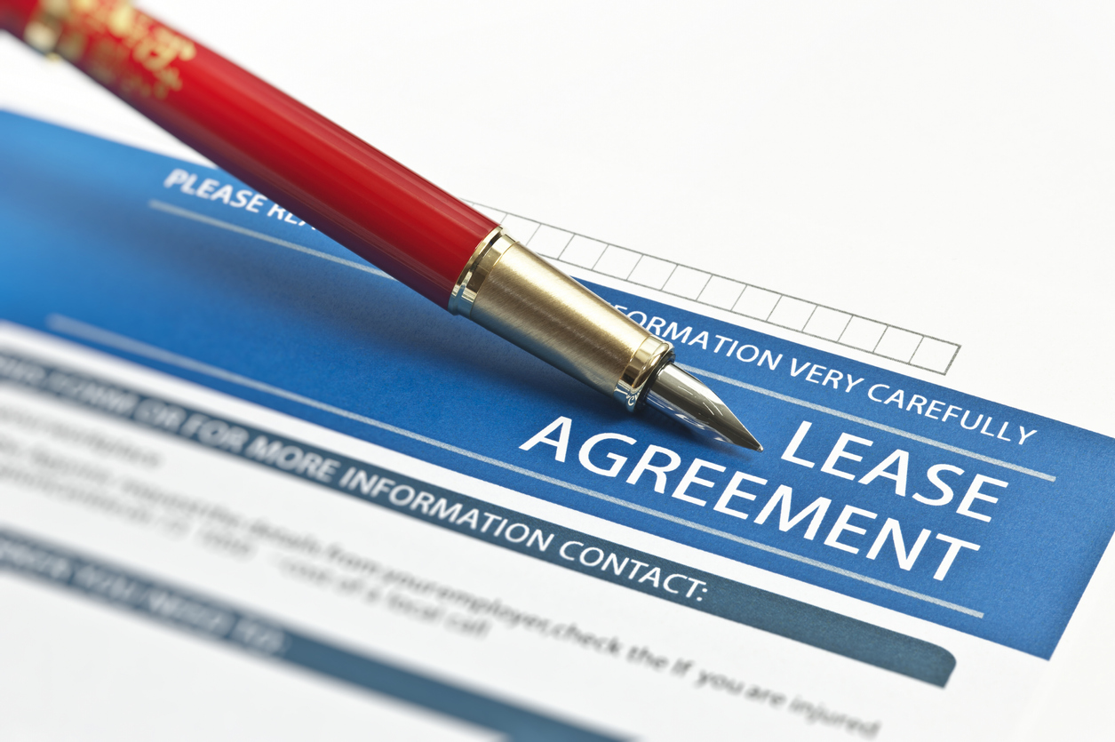 Lease Agreement with a pen on top of it