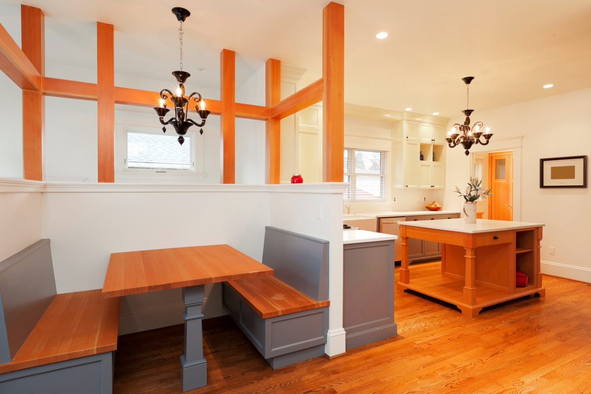 Kitchen nook next to large open kitchen with island