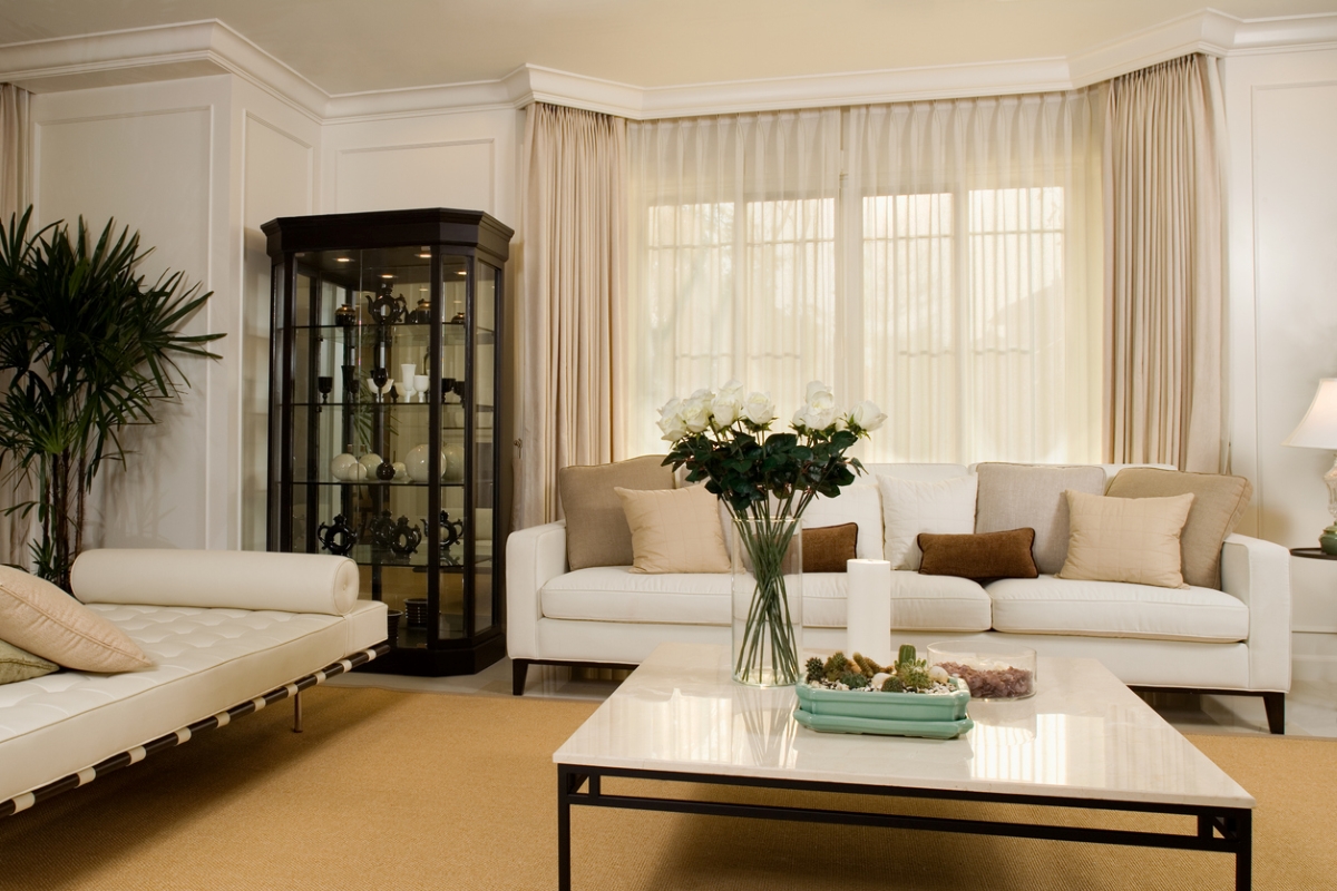 Modern living room with neutral curtains