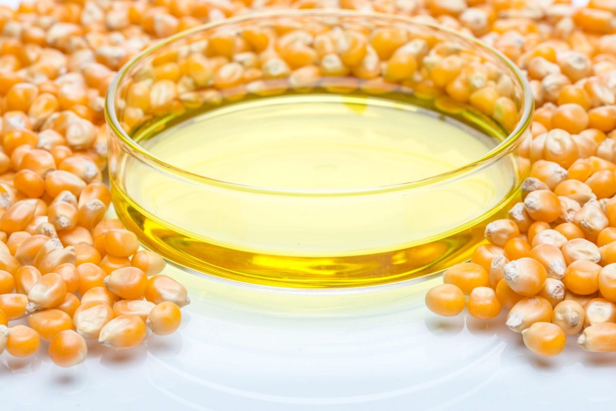 foods that never expire - corn syrup in shallow clear glass with corn kernels around