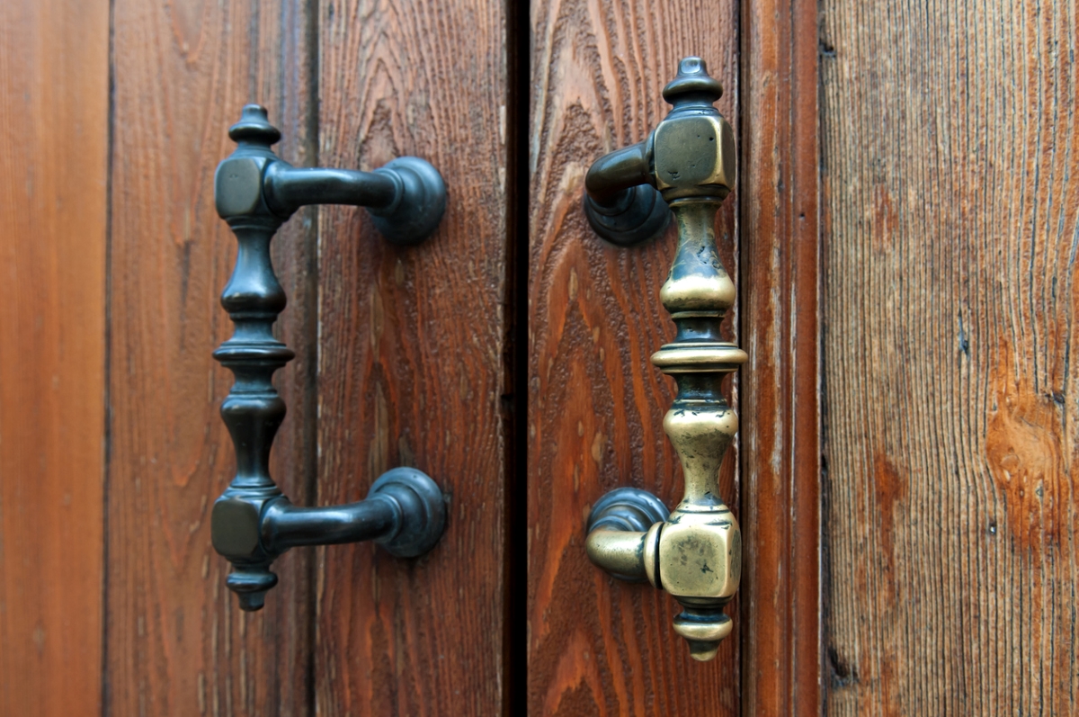uses for hydrogen peroxide - two antique door handles with different finishes