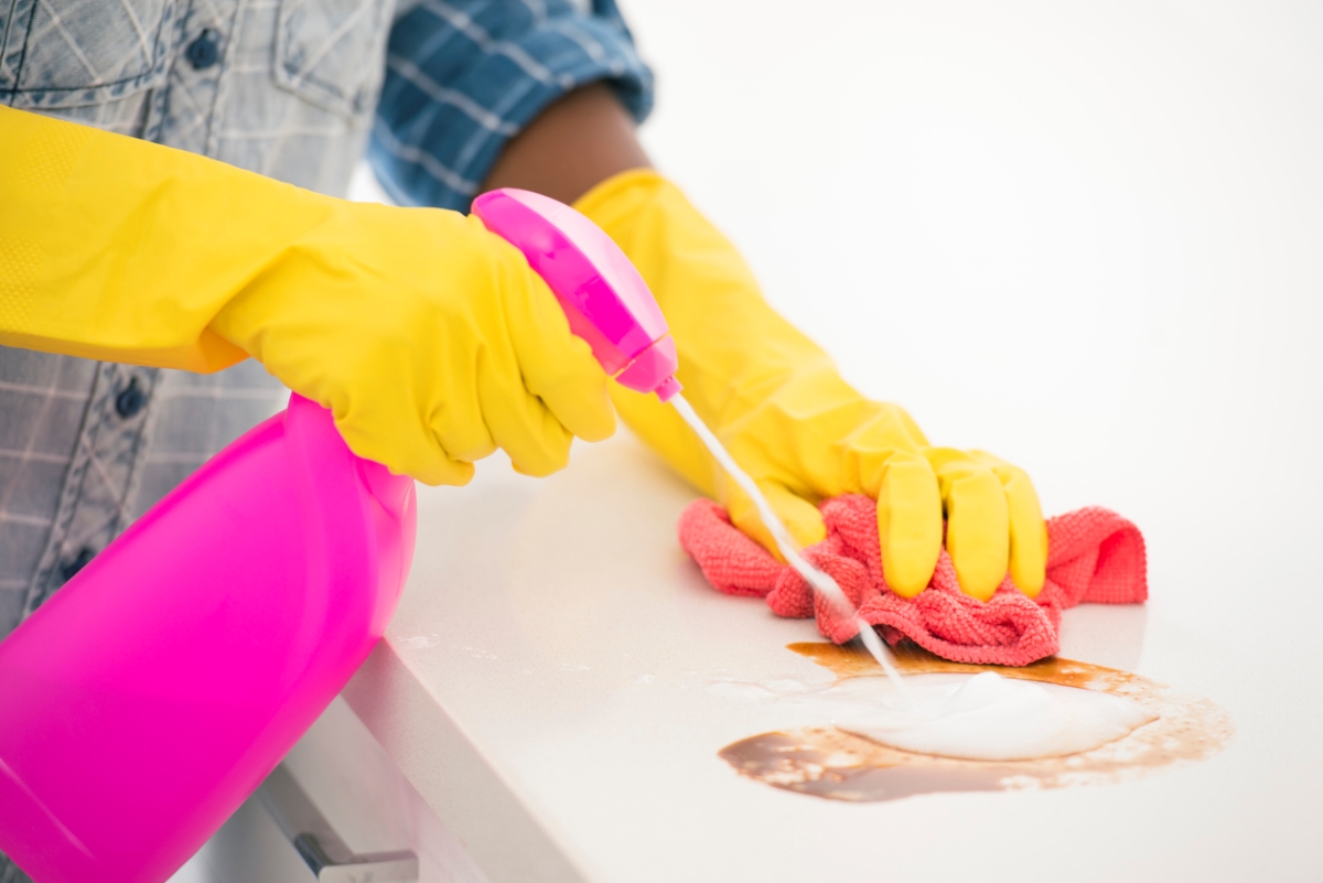 uses for hydrogen peroxide - pink clean spray bottle used for kitchen table stain