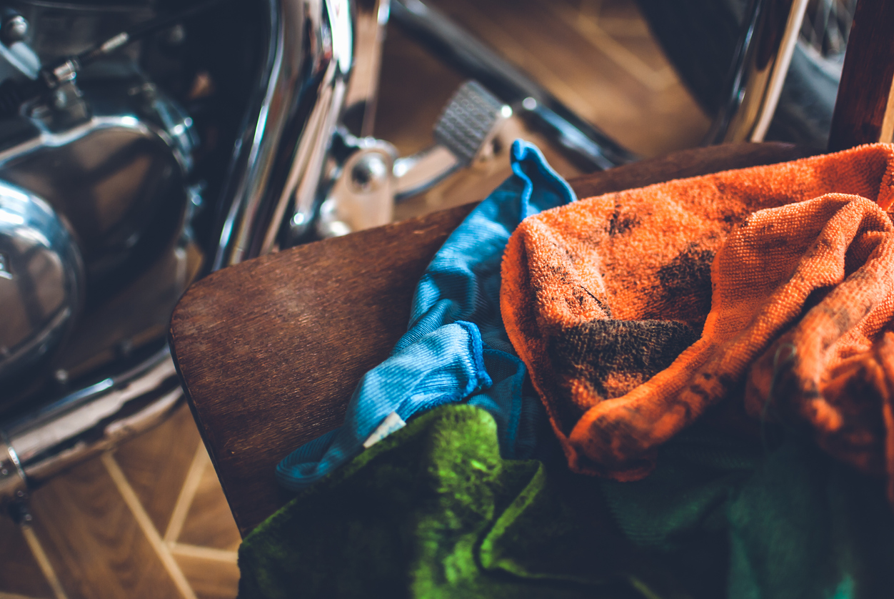 Pile of colorful dirty rags laying nearby chopper
