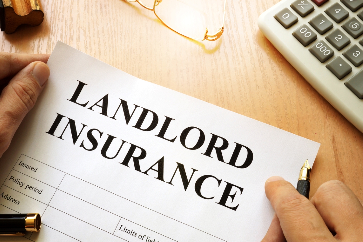 Person holding landlord insurance paperwork