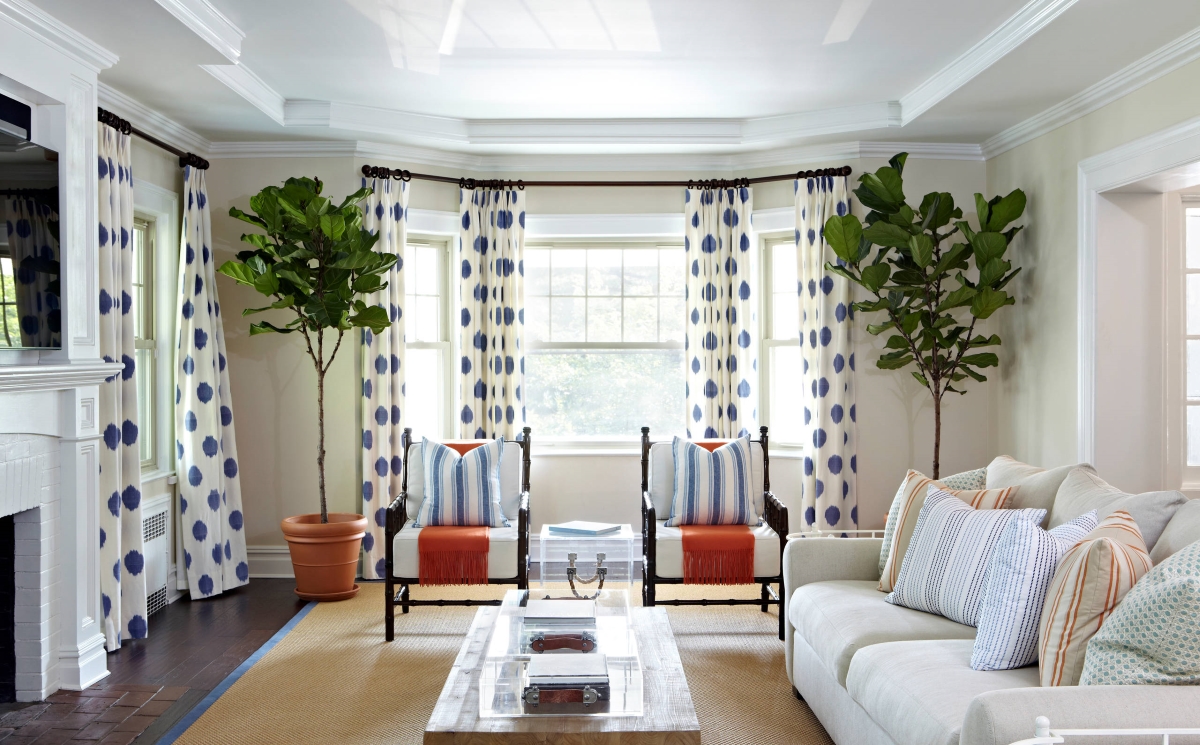 Bright living room with blue polka dot curtains