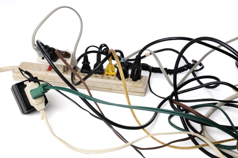 Od power strip overloaded with too many cords plugged into it.