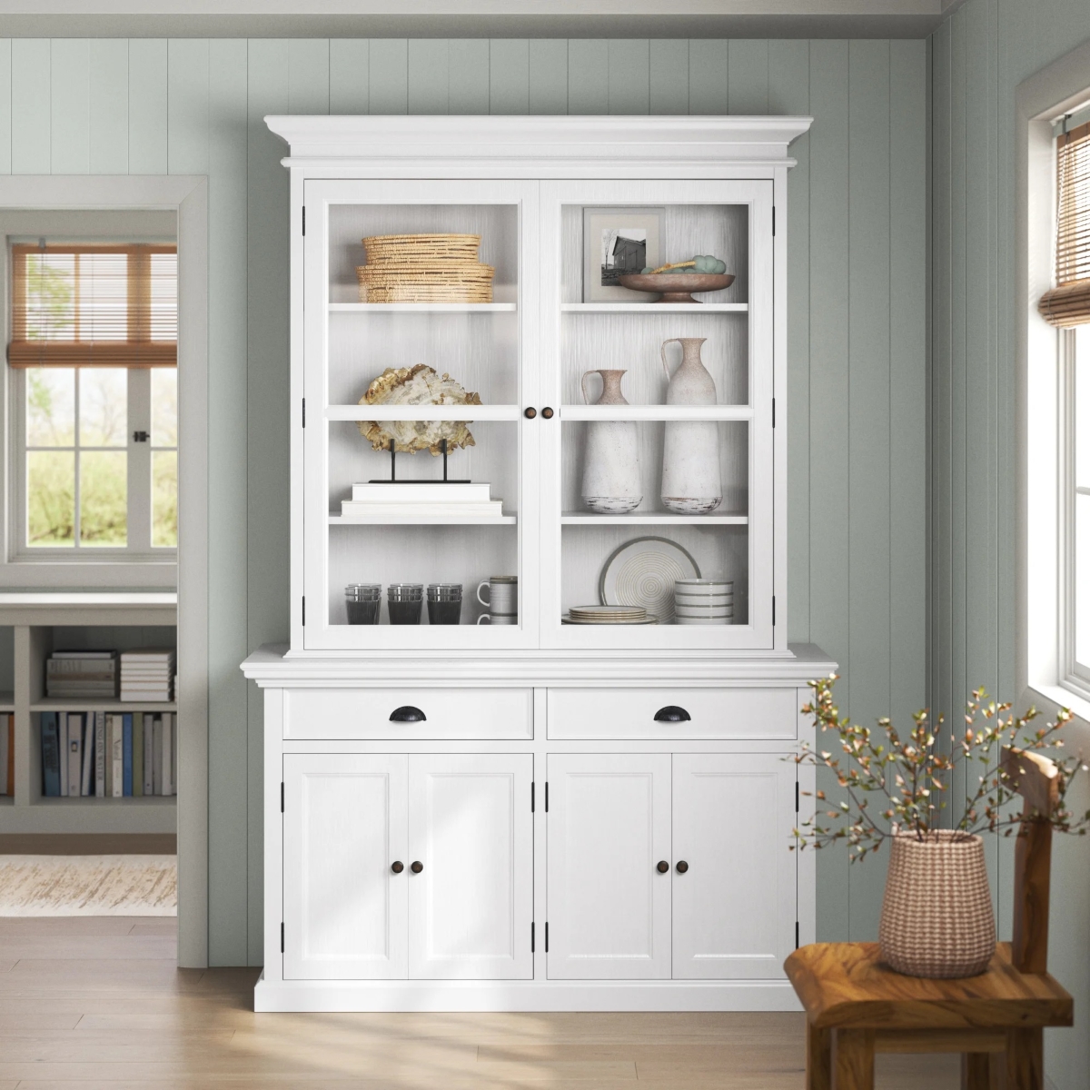 White china cabinet with decorative items on shelves