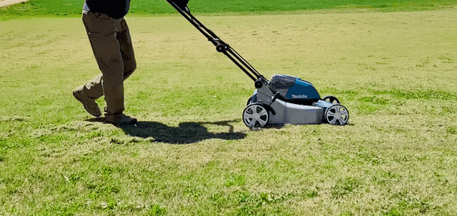 Man pushing the Makita Lawn Mower