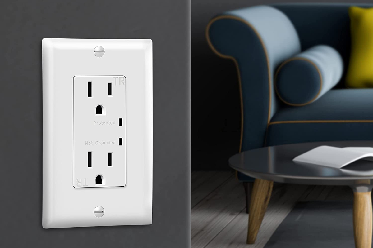 3D product render of a TOPGREENER surge receptacle power outlet on a living room wall