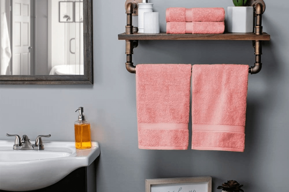 The Best Hand Towel option hanging on an over-the-toilet storage rack in a bathroom