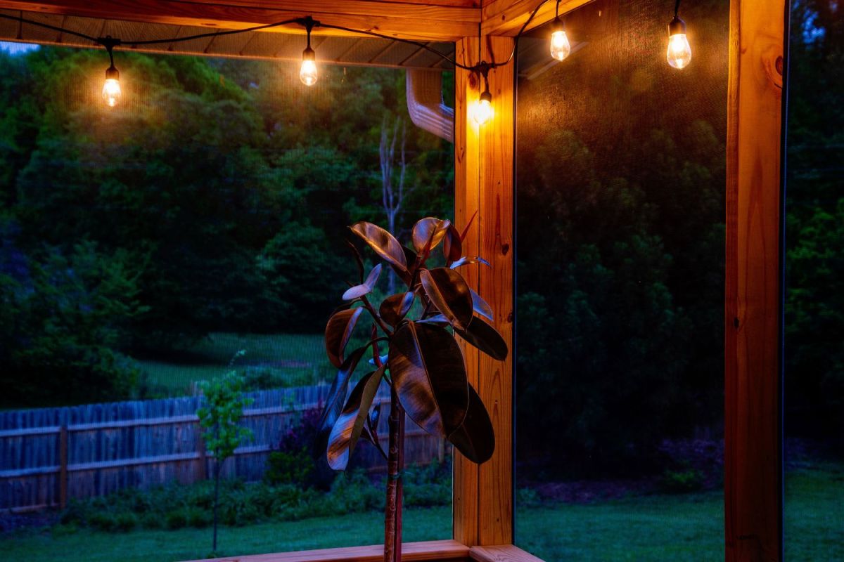 Brightech solar string lights lit up at night on outdoor deck