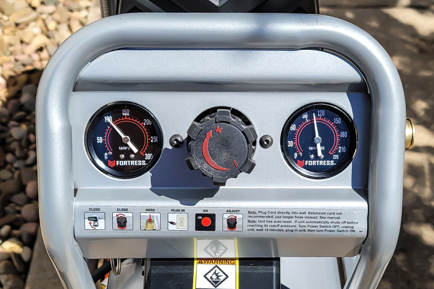 A close-up of the gauges and controls on the Harbor Freight Fortress air compressor