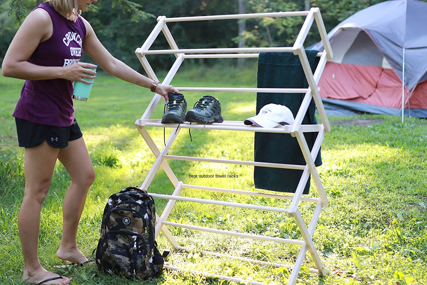 The Best Outdoor Towel Racks Option storing a towel, hat, and shoes at a campsite