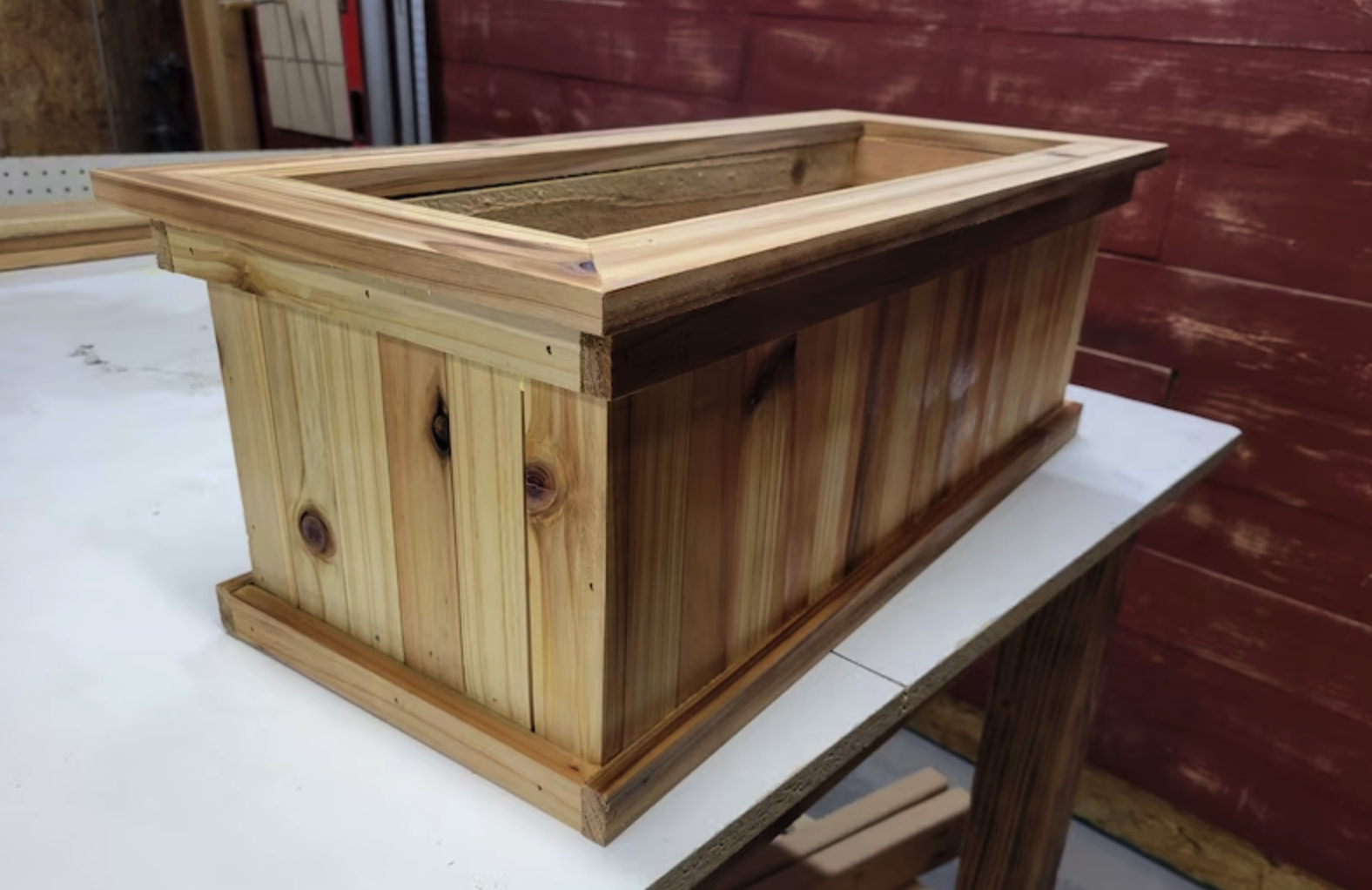 rectangular planter box made of cedar wood on top of workshop table
