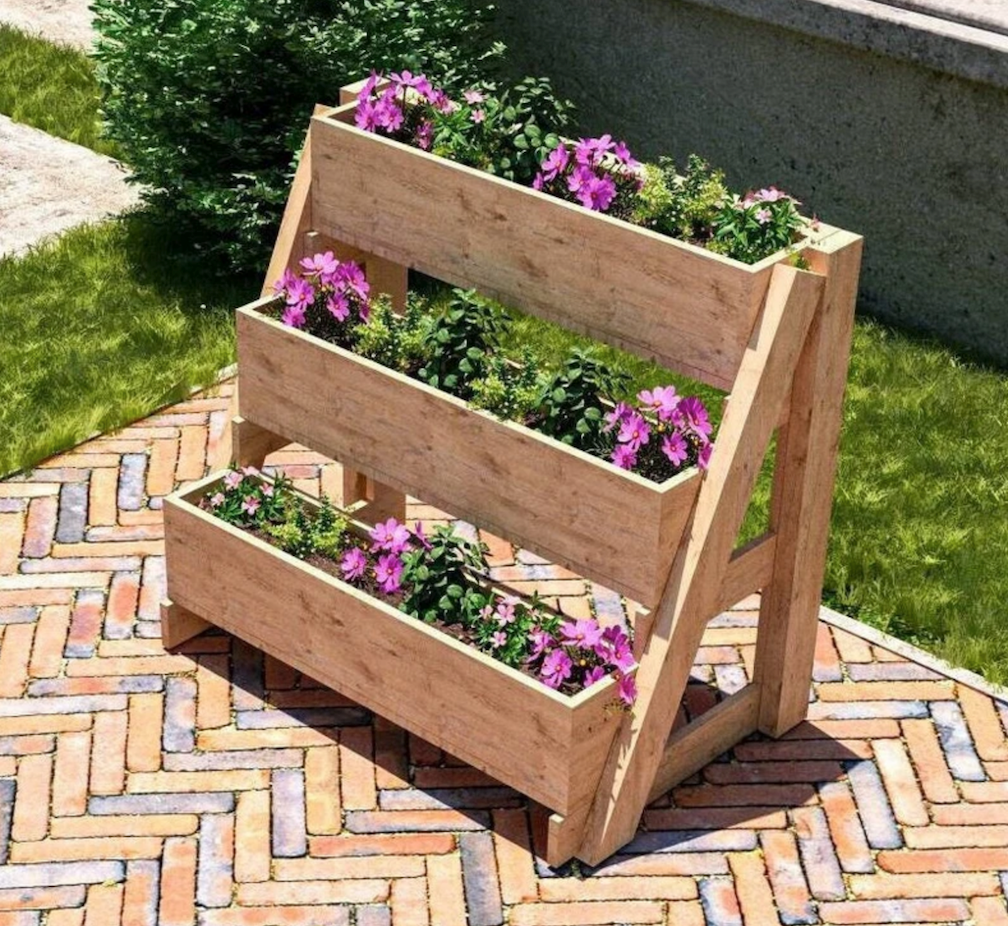 Three-tiered easel planter box with flowers on stone patio