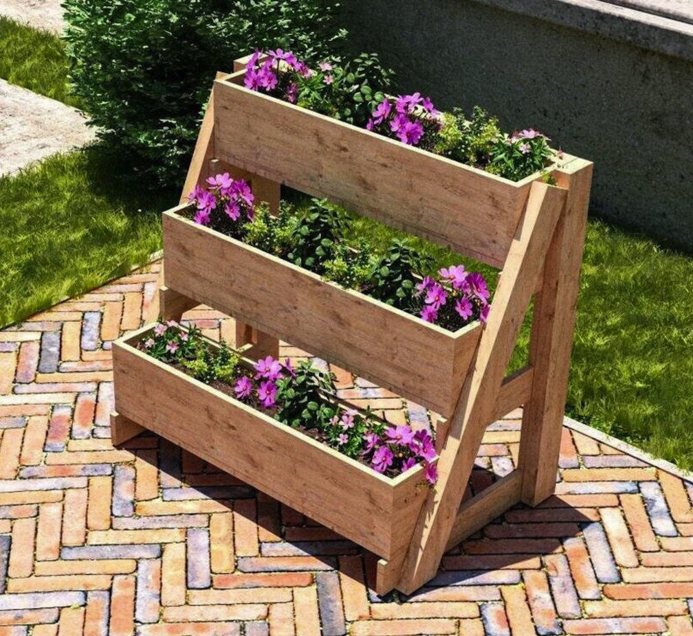 three tiered easel planter box with flowers on stone patio