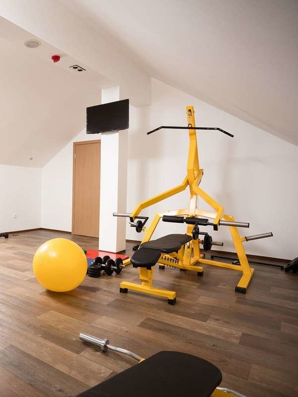 home gym with yellow gym equipment
