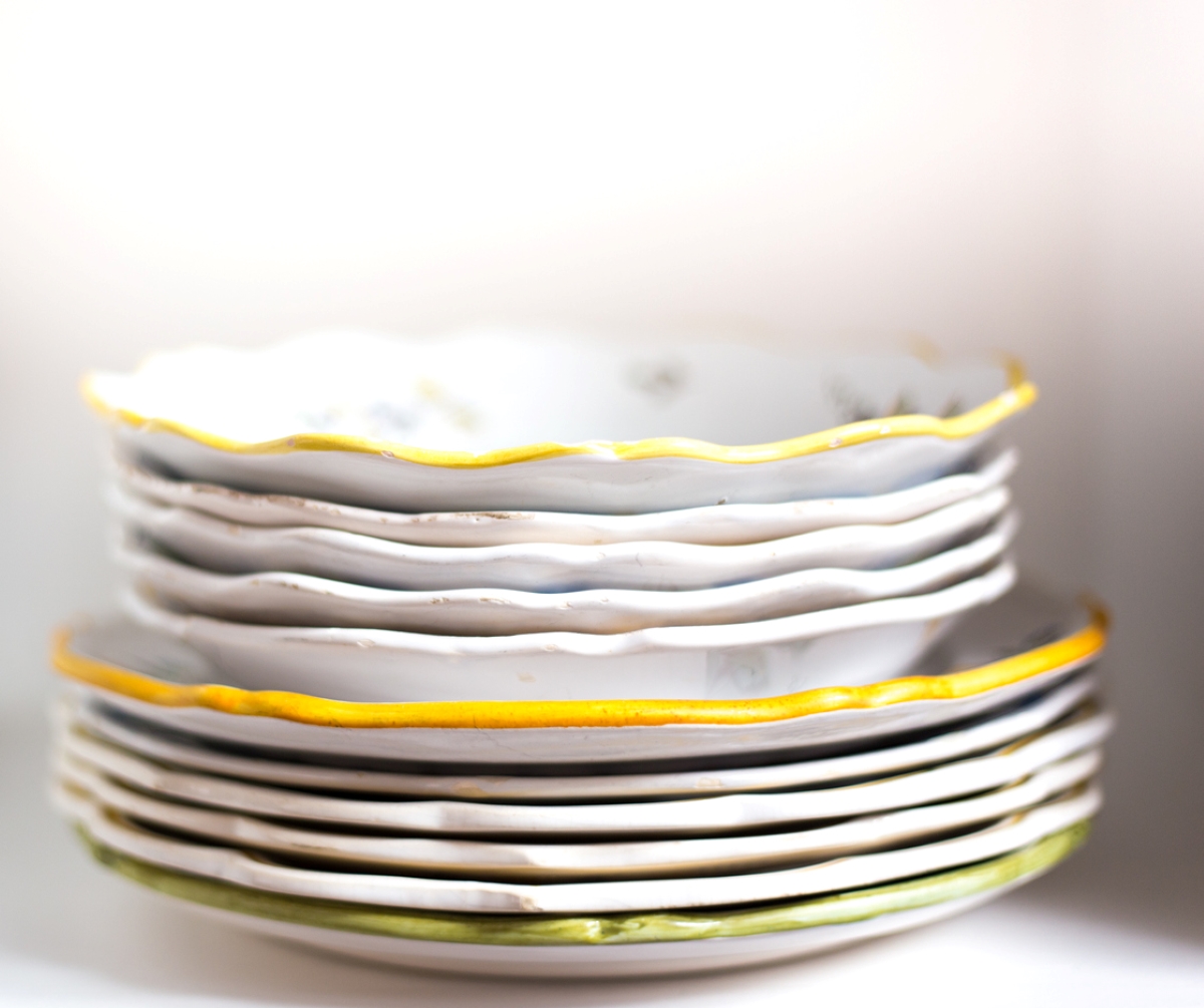 Stack of old chipped kitchen dishes