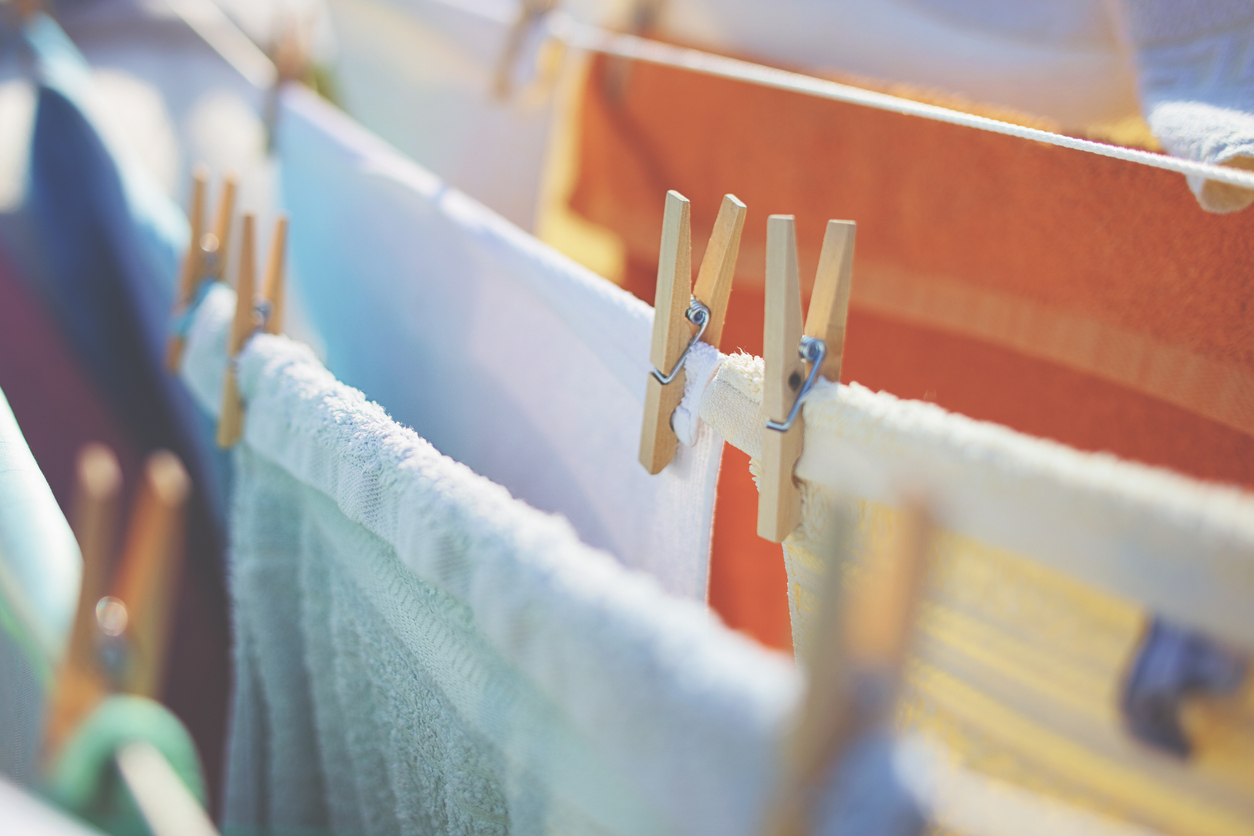 towels hanging on clotheslines with clothespins