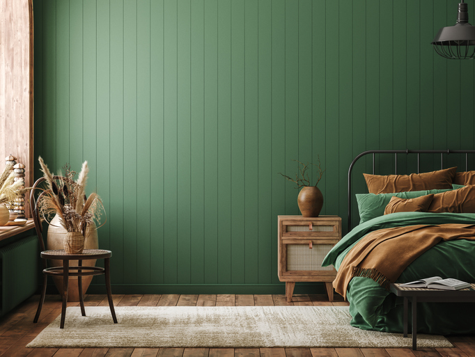 a-green-and-tan-bedroom-with-green-wainscotting-and-rattan-accents