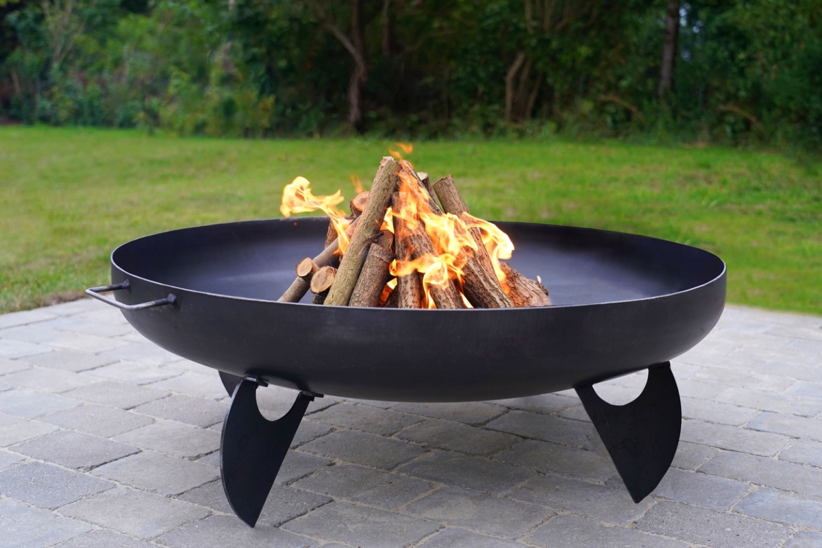 Metal fire pit on brick patio