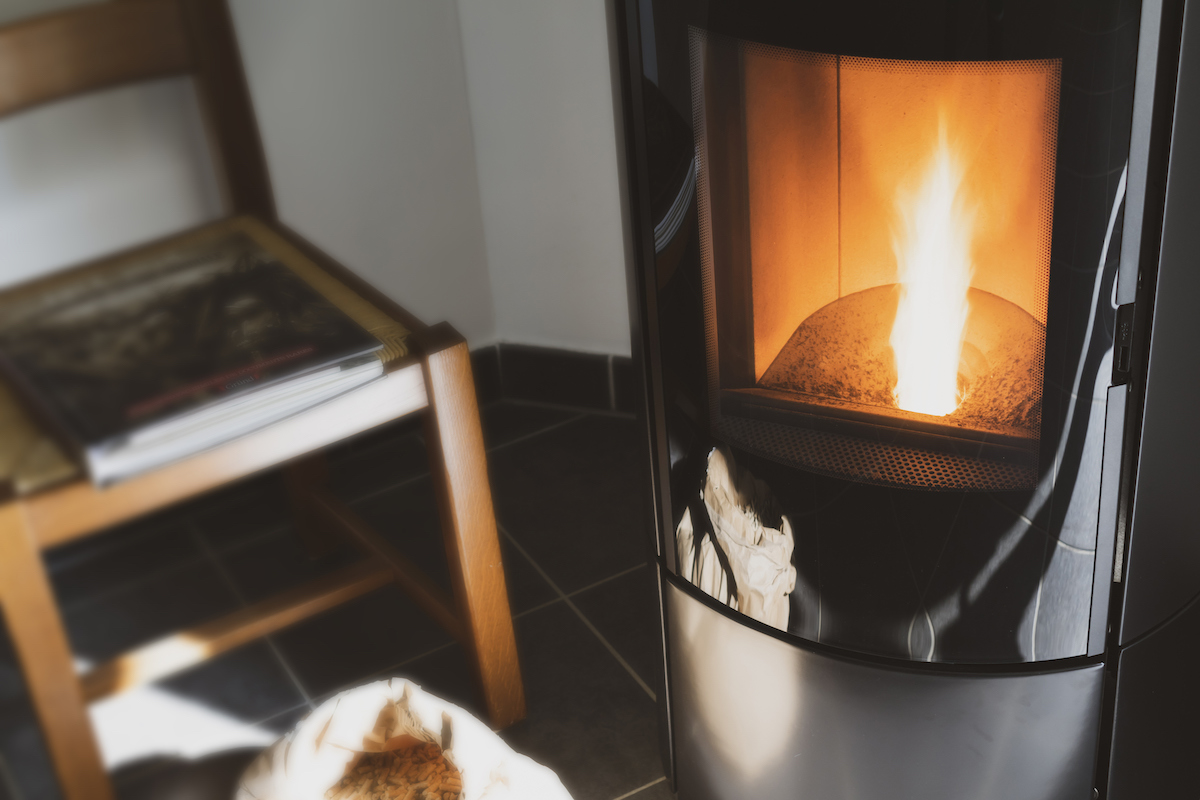 modern pellet wood stove with flame