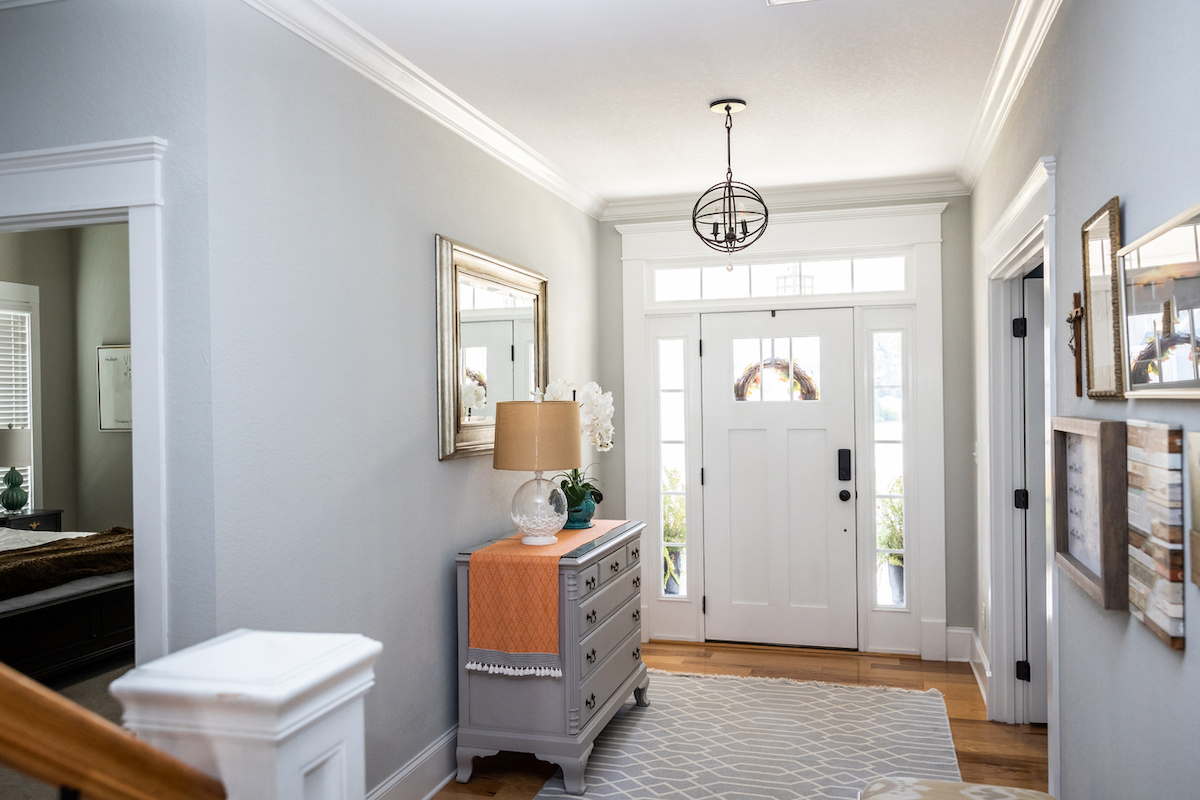 Interior entryway with white fiberglass door and windows