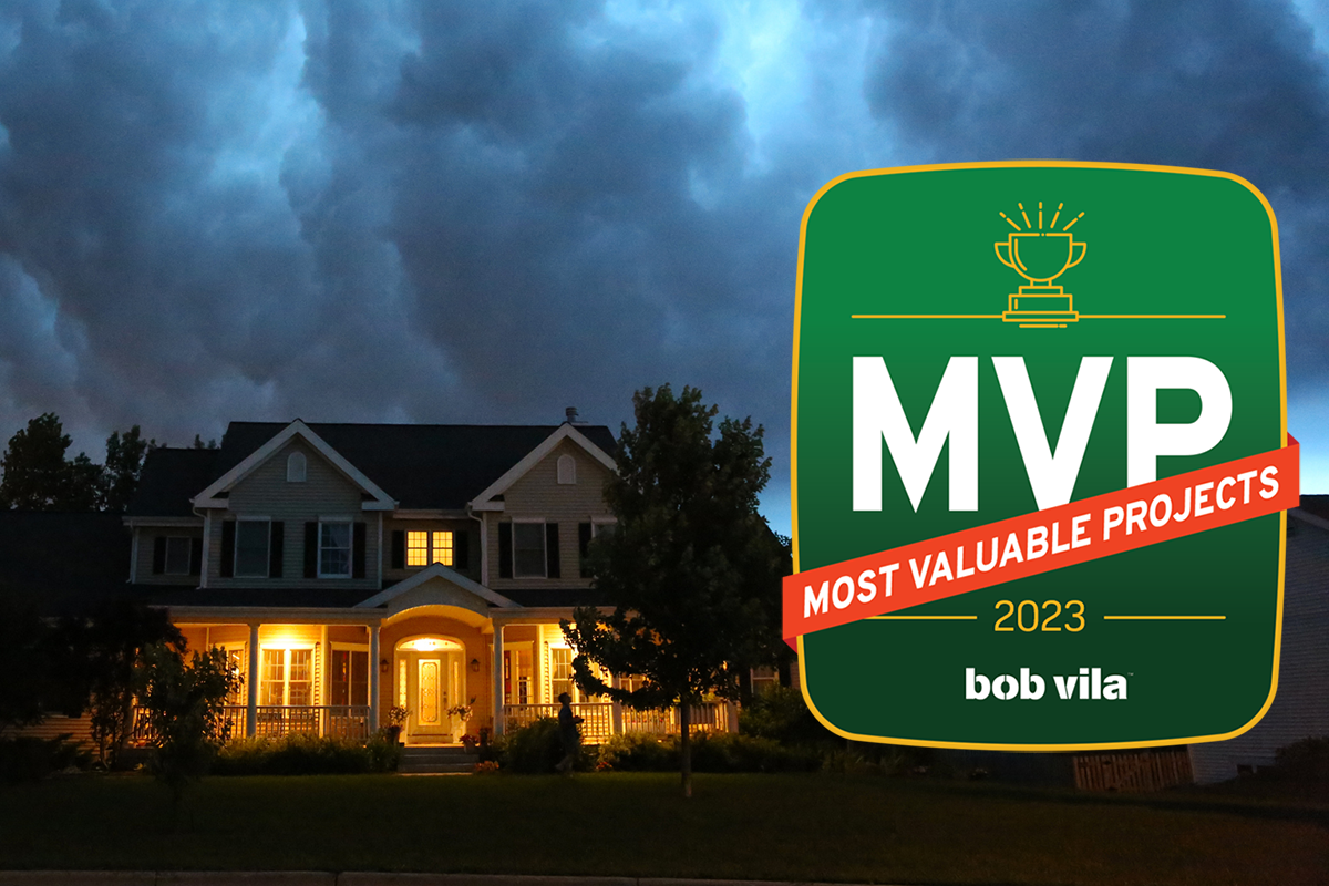 home with lights on with storm overhead and Bob Vilas most valuable projects 2023 graphic overlay