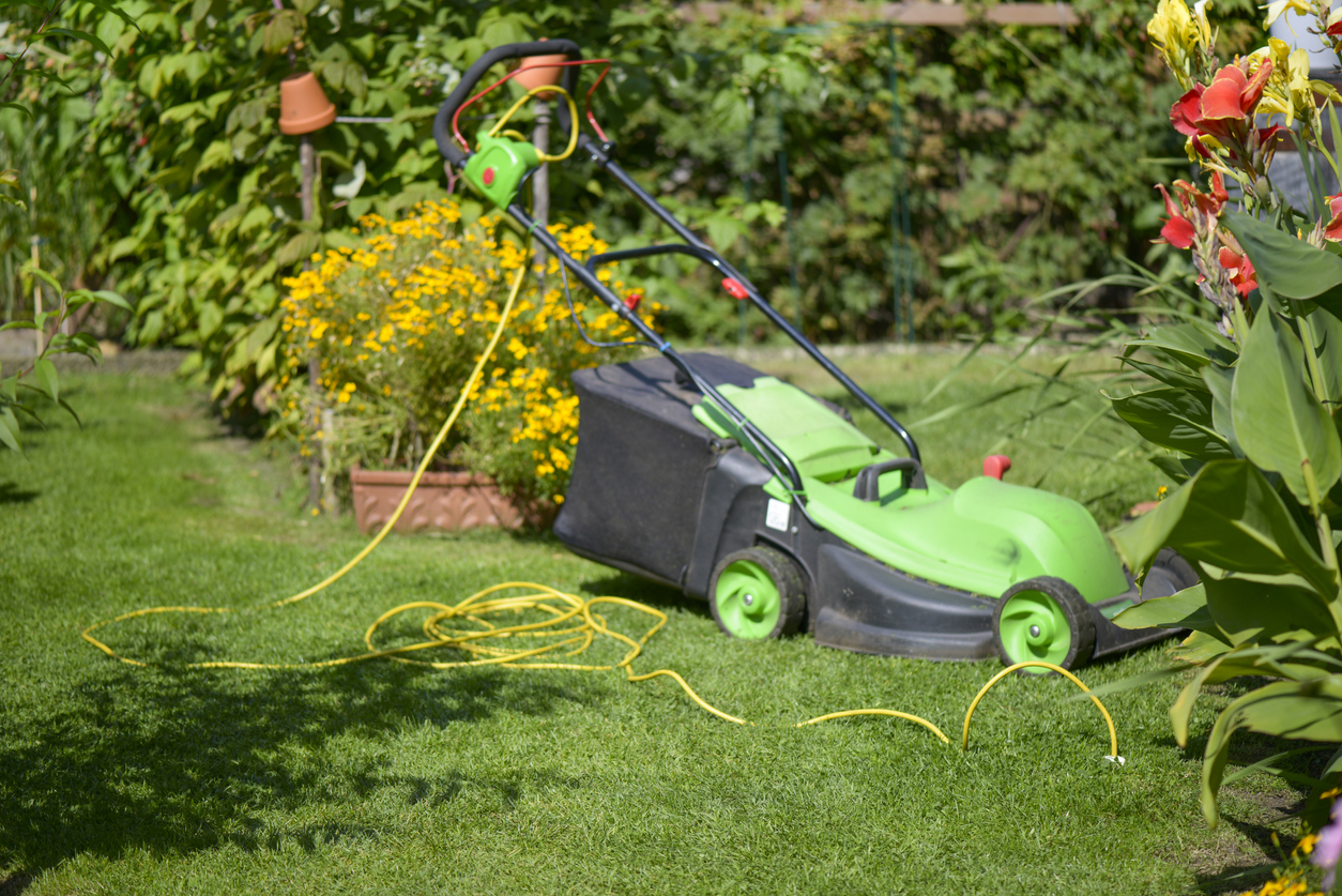 Lawn mower in the garden, Electrically driven via the underground cable