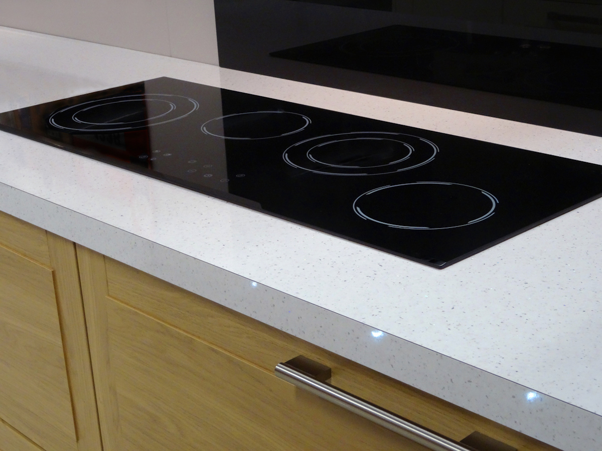 close up of laminate kitchen countertop with electric range