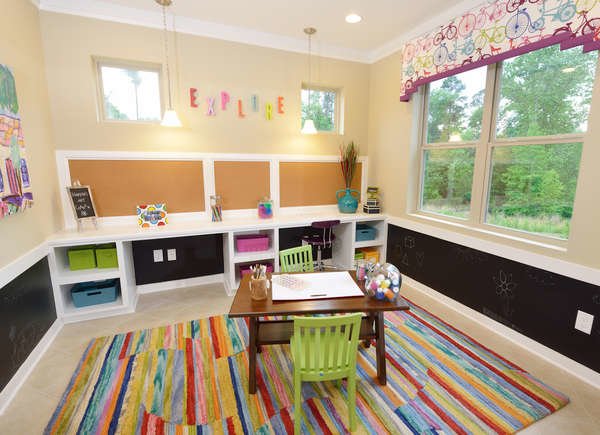 kids playroom with colorful rug and child sized table