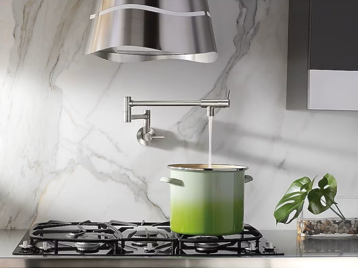 Green pot filled with kitchen pot filler faucet