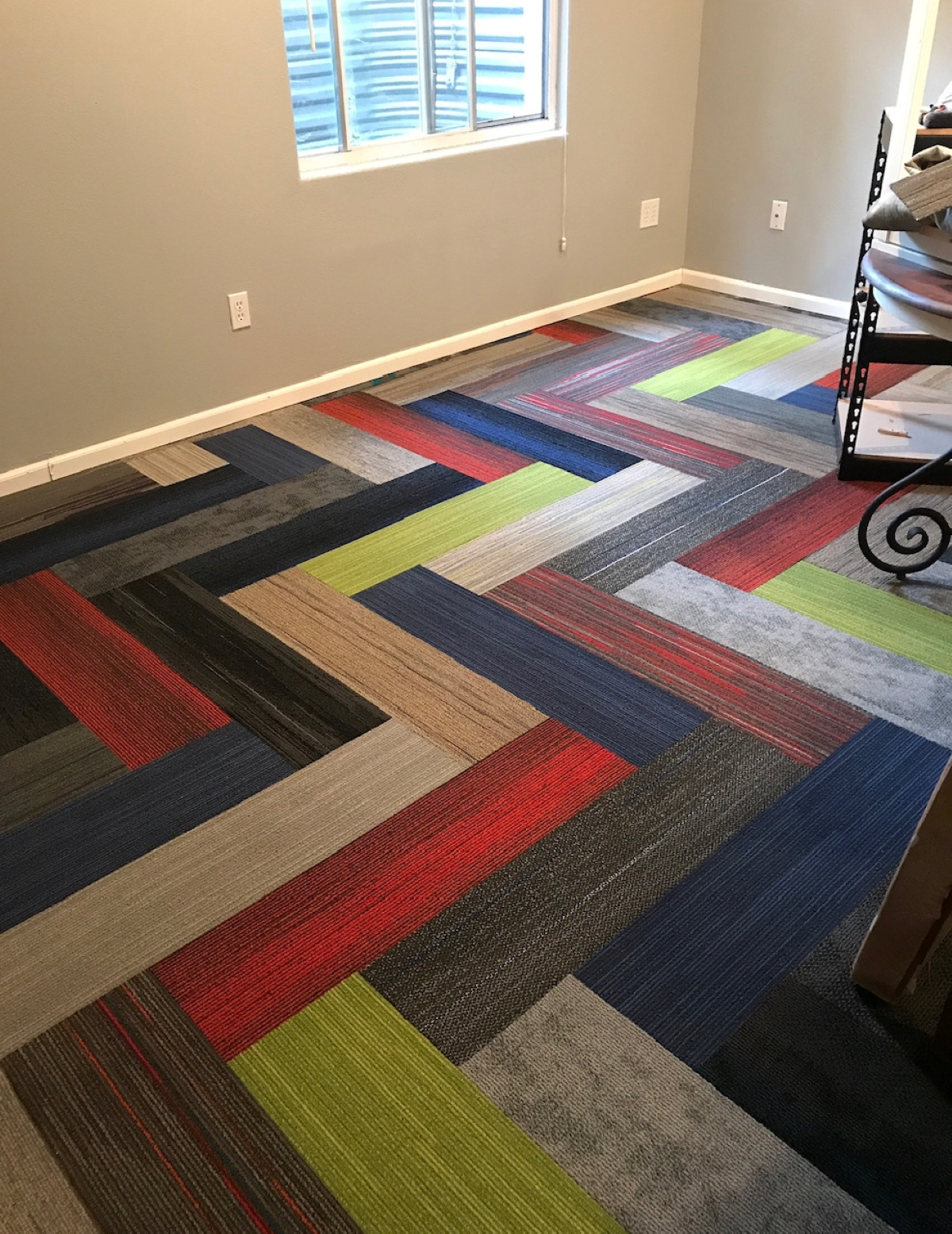 bold color-block flooring tiles in a zig zag pattern