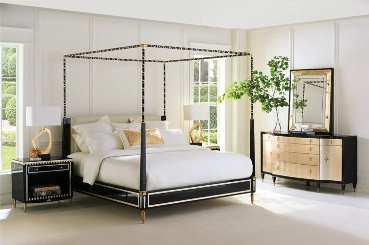 Courturier-King-Canopy-Bed-by-Caracole-is-a-black-wood-and-brass-canopy-bed-in-a-bedroom-with-matching-furnishings