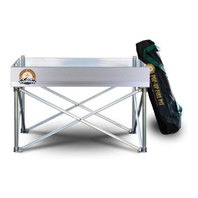 The Fireside Outdoor Pop-Up Pit next to its carry bag on a white background.