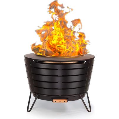 The Tiki Brand Patio Smokeless Fire Pit burning a fire on a white background.