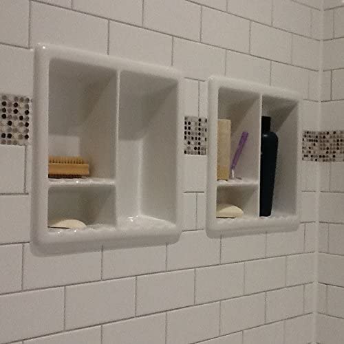 white tiled shower with two shiny white square niches with compartments side by side