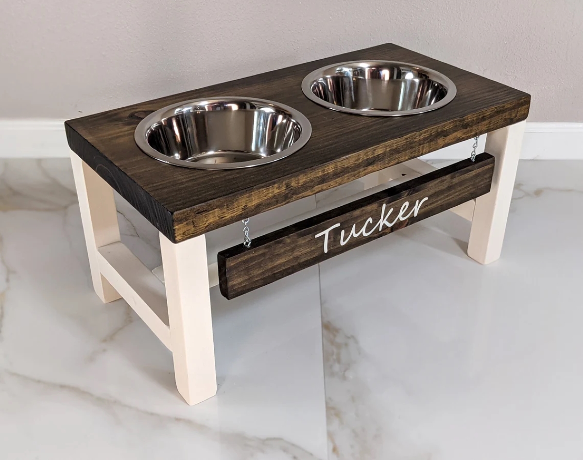 Custom double pet dish stand made of wood with name "Tucker" on front