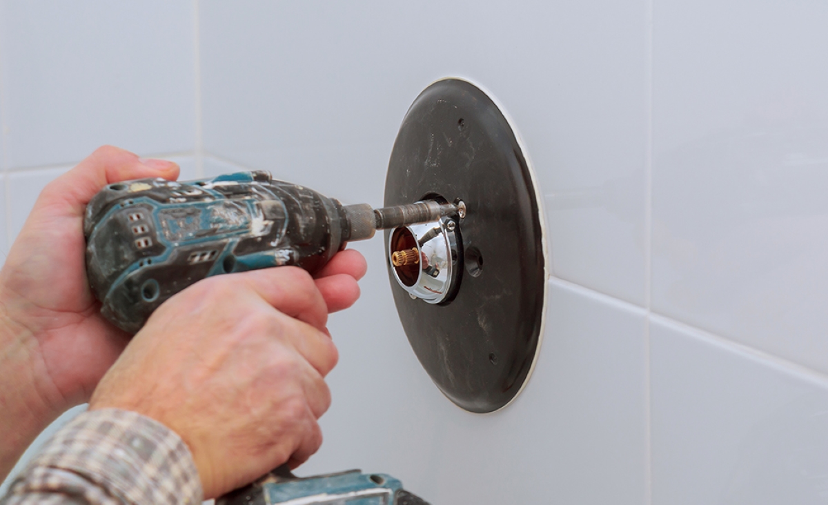 Removing shower handle plate with drill