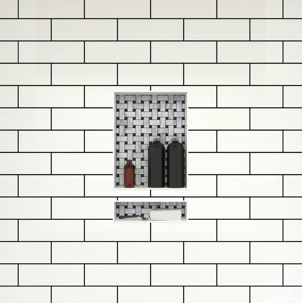 white tiled bathroom wall with intricate tiled niche