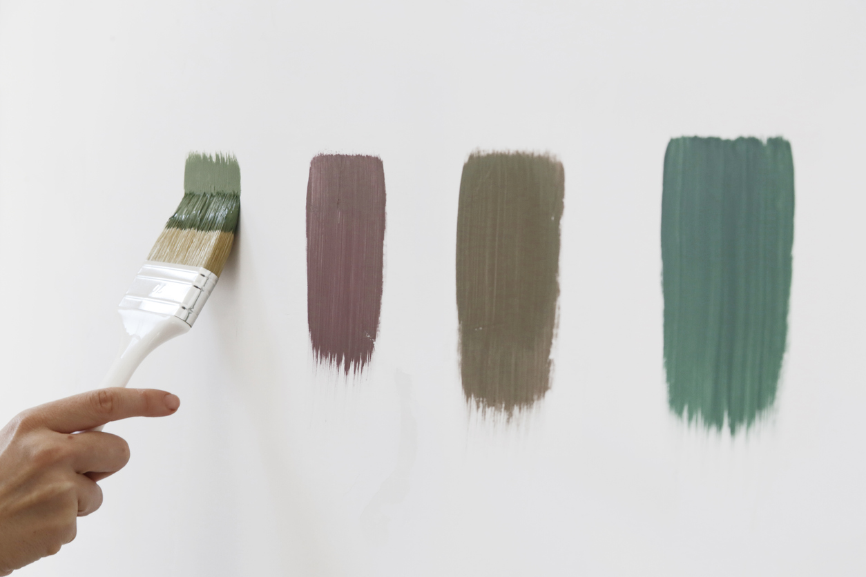 A different color swatches on the white wall.